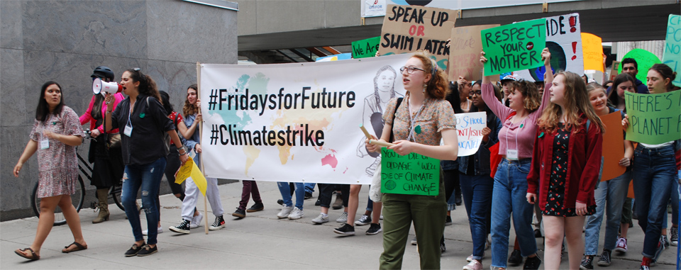  #FridaysforFuture #ClimateStrike banner leading the march out of City Hall square, May 24th.
